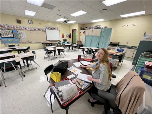 teacher working on lesson plan before school starts